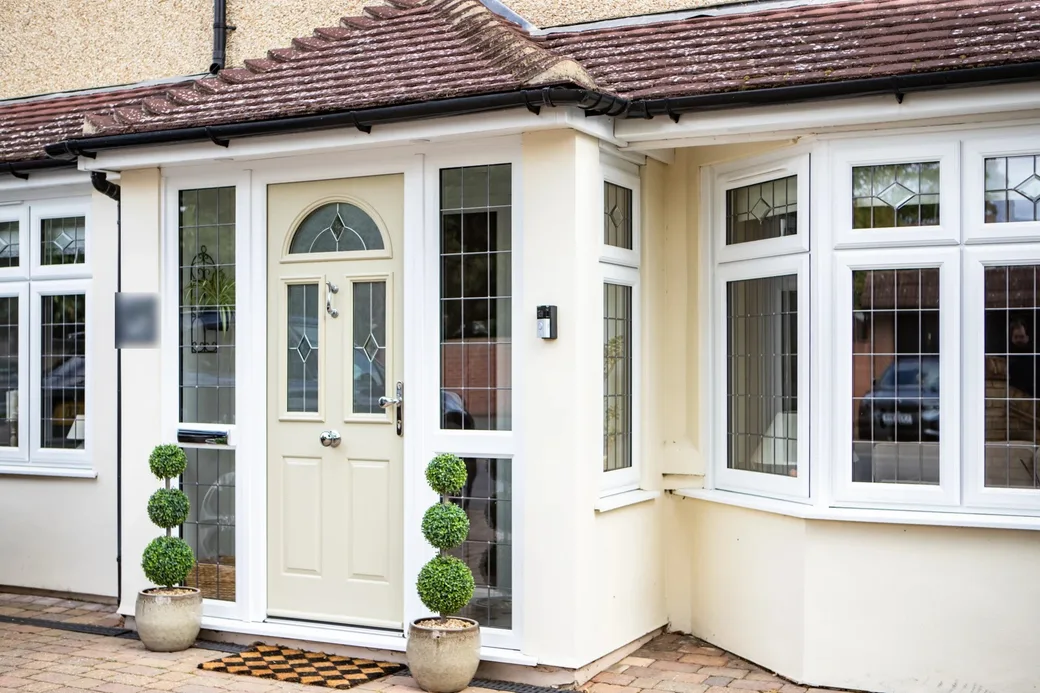 New white windows and entrance porch door installed by Direct Windows